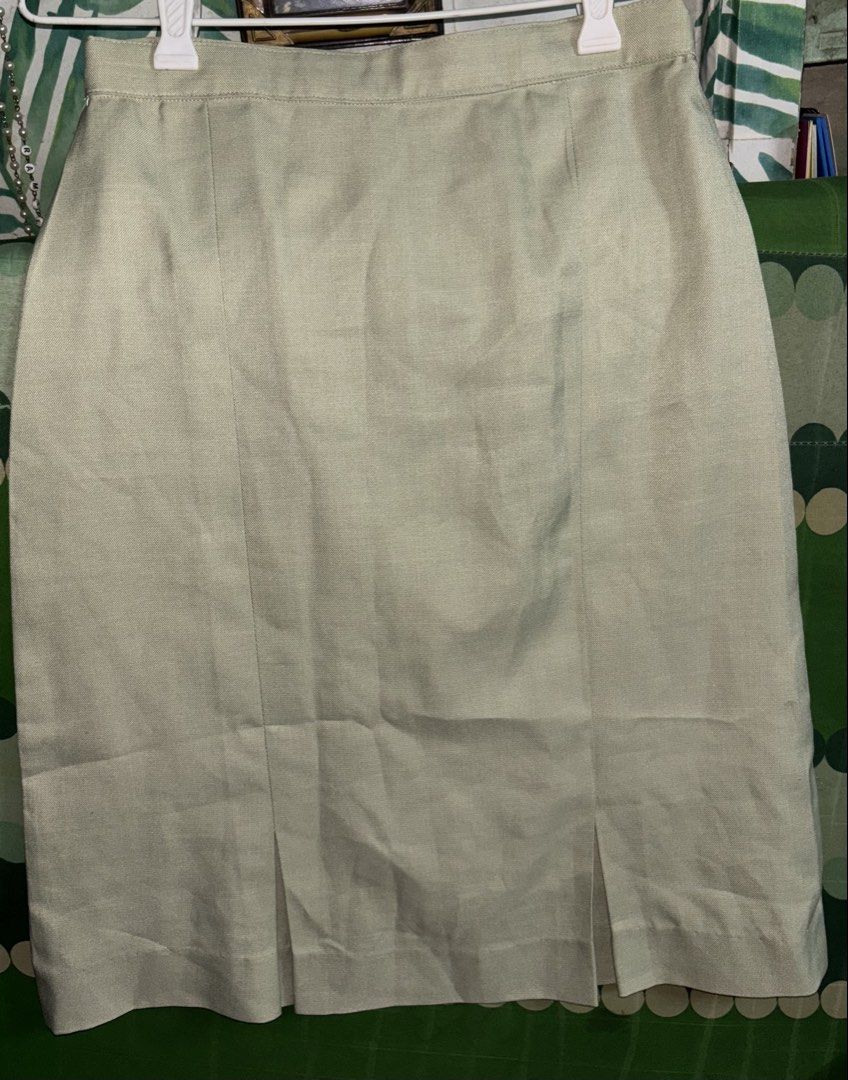 Beige Knee Length Skirt With Front Pleats (Category: Skirts) located in Manila. Submitted by whatspoppin3000 (Listing ID 1468586500, Image 1). Description: - Color: Neutral beige - Length: Knee-length - Design: Structured waistband with vertical front panel seams and small inverted hem pleats - Closure: Standard back zip - Style: Professional and versatile, perfect for pairing with blouses or sweaters.