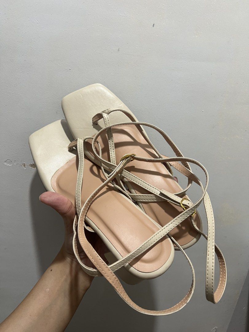 Size 8 Beige Square Toe Block Heel Strappy Sandals (Category: Heels) located in Manila. Submitted by 34samf (Listing ID 1468606838, Image 1). Description: - Style: Beige strappy sandals with square toes and block heels - Size: 8 - Closure: Slender ankle straps with gold-tone buckles - Comfort: Padded insoles for all-day wear - Condition: Clean uppers, sturdy heels, with moderate wear on the soles - Perfect for: Casual outings, work, or weekend da