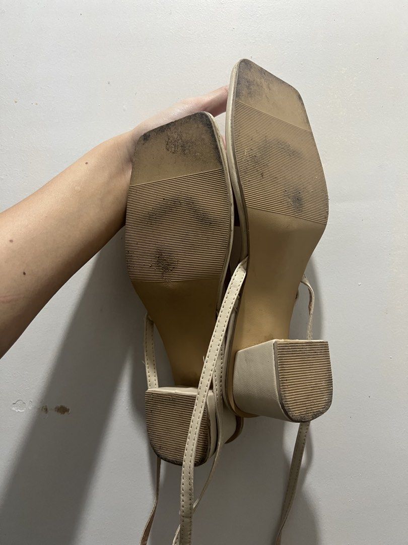 Size 8 Beige Square Toe Block Heel Strappy Sandals (Category: Heels) located in Manila. Submitted by 34samf (Listing ID 1468606838, Image 3). Description: - Style: Beige strappy sandals with square toes and block heels - Size: 8 - Closure: Slender ankle straps with gold-tone buckles - Comfort: Padded insoles for all-day wear - Condition: Clean uppers, sturdy heels, with moderate wear on the soles - Perfect for: Casual outings, work, or weekend da