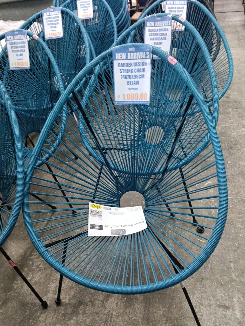 Belavi Garden Design String Chair Blue (Category: Chairs) located in Manila. Submitted by jesicahmrsantarosa (Listing ID 1468573998, Image 2). Description: - Type: Blue string chair with sturdy black metal legs - Versatility: Perfect for both indoor and outdoor setups - Dimensions: 74cm (L) x 70cm (W) x 96cm (H) - Design: Comfortable seating with a stylish circular opening at the base - Availability: Multiple pieces in stock, ready for purchase.