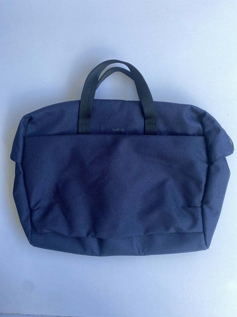 Bellroy Via Workbag Navy Blue (Category: Briefcases) located in Cavite. Submitted by benta_bounce (Listing ID 1468553774, Image 1). Description: DESIGN INSIGHTS • Excellent condition • Padded 16” laptop sleeve • Ultra-wide zip opening for easy access • Surprisingly spacious main compartment • Raised internal mesh zip pocket • External quick-access pocket with key clip • Detachable padded shoulder strap • Soft, rolled-edge webbing handles • Water-