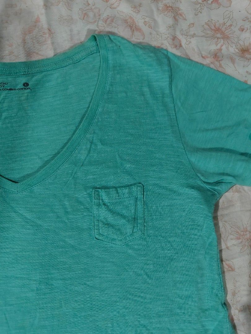 BENCH teal y2k V-neck pocket shirt (Category: Shirts) located in Bulacan. Submitted by angel.decluttersx (Listing ID 1468593003, Image 3). Description: large size L 28" W 17" cotton fabric material no issue.