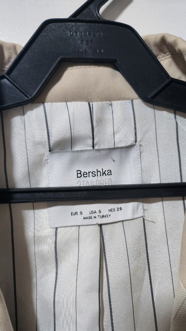 Bershka 2Tailored Half Pinstripe Half Solid Beige Double Breasted Vest (Category: Sleeveless) located in Taytay. Submitted by luxebagcray (Listing ID 1468597534, Image 2). Description: - Brand: Bershka - Size: S - Origin: Made in Turkey - Design: Unique half-solid beige and half-pinstripe style - Details: Double-breasted front with dark buttons, two front pockets, fully lined interior - Styling: Perfect statement piece for layering over plain shi