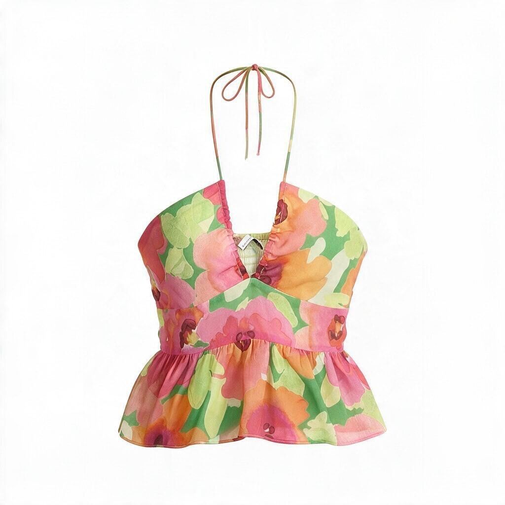 Bershka Floral Halter Top (Category: Sleeveless) located in Batangas. Submitted by wearmegals (Listing ID 1466088728, Image 1). Description: - Brand: Bershka - Design: Vibrant pink, orange, and green floral print with a flowy peplum hem - Details: Adjustable tie straps at the neck and a stylish keyhole cutout at the bust - Condition: Worn once - Large on tag but can fit small to medium .