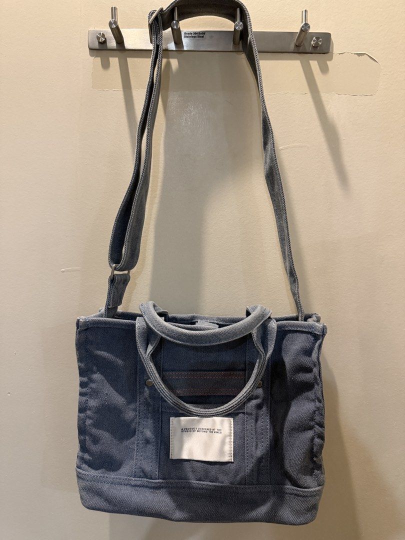 Beyond The Vines Canvas Carryall 01 (Category: Tote Bags) located in Manila. Submitted by db_collective (Listing ID 1468503970, Image 1). Description: - Brand: Beyond The Vines - Style: Canvas Carryall (first edition) - Color: Indigo - Dimensions: 9.5" x 12.5" x 3.5" - Features sturdy top handles and an adjustable shoulder strap, snap closure - Designed with a signature front fabric label - Durable everyday bag that gets better with time.