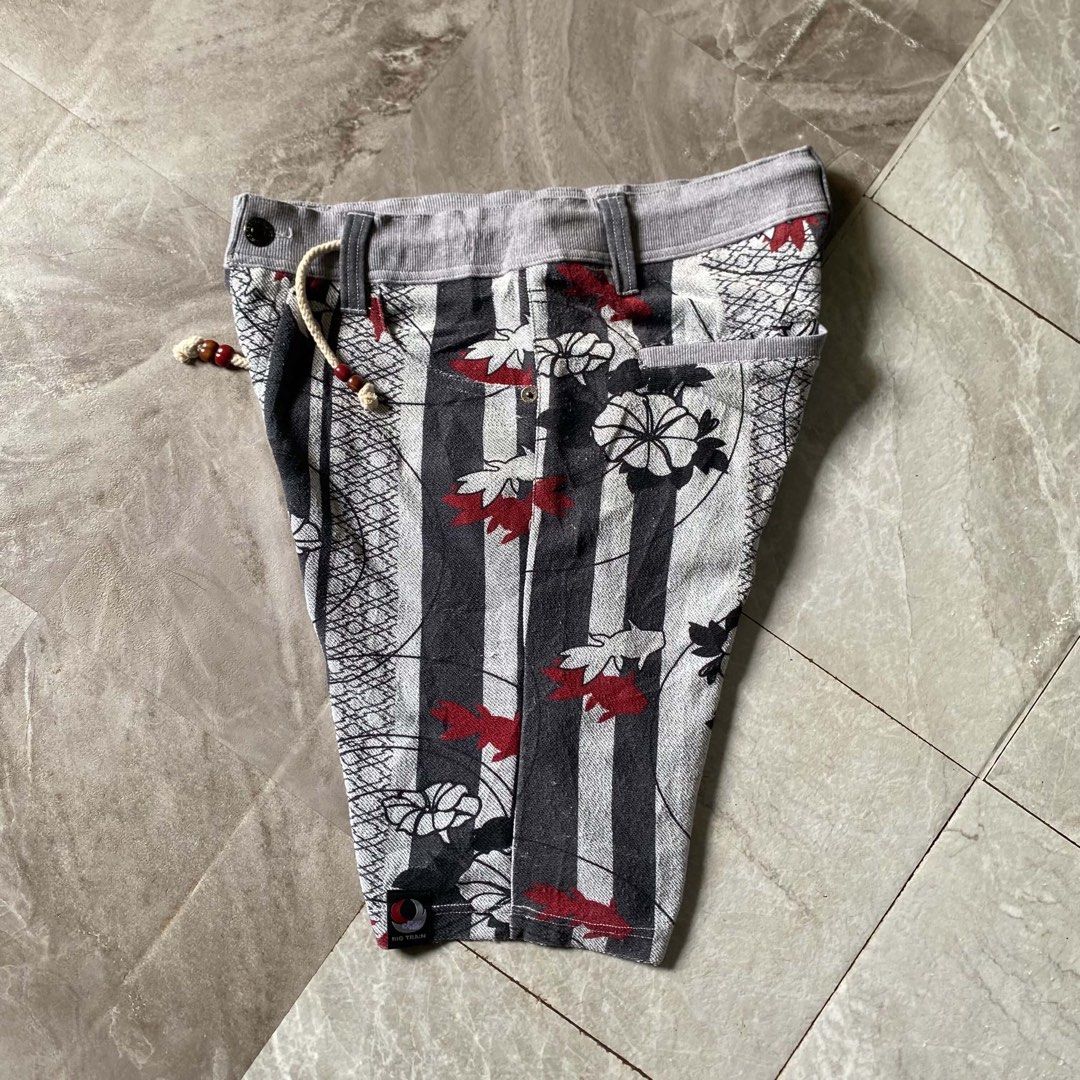 Big Train Japanese Floral Pattern Shorts (Category: Shorts) located in Butuan. Submitted by jc13thrifts (Listing ID 1468708698, Image 2). Description: - Brand: Big Train - Design: Detailed Japanese floral and goldfish pattern - Color Scheme: Grey, black, and red - Waistband: Drawstring with bead details - Features: Branded buttons, woven logo tag at the hem, and back welt pockets - Style: Unique Japanese streetwear.