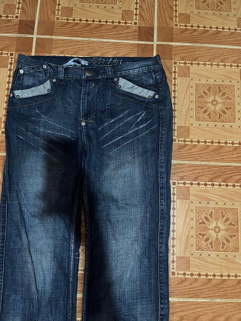 Big Train Osaka Denim Jeans 3L (Category: Jeans) located in Kidapawan. Submitted by azythrift (Listing ID 1468695790, Image 2). Description: - Brand: Big Train Osaka - Style: Dark wash denim jeans with straight leg fit and front thigh whiskering - Size: 3L - Material: 100% premium cotton - Key Features: Unique front flap pockets with contrast detailing and Japanese wave graphic with branding on the inner waistband - Condition: Excellent, highly r