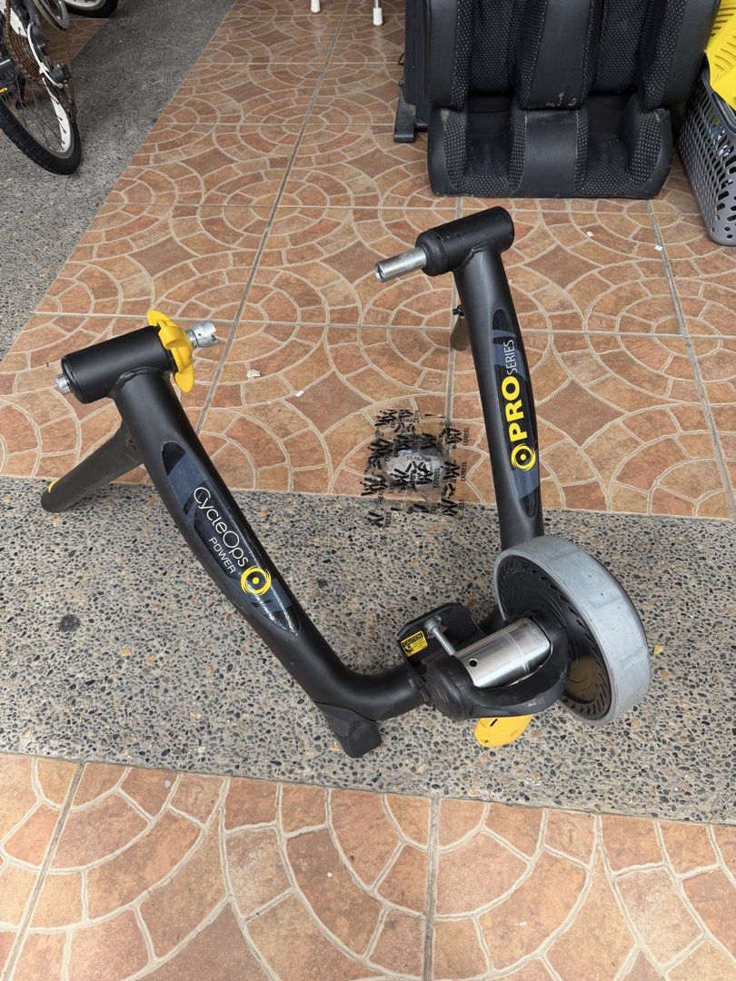 Bike Trainer (Category: Other Sports Equipment and Supplies) located in Bulacan. Submitted by mysticdeer.6d7f47 (Listing ID 1468599506, Image 2). Description: Ang bagay na nasa larawan ay isang indoor bicycle trainer na tinatawag na CycleOps Super Magneto Power Pro Series Trainer. Ginagamit ito upang gawing stationary exercise bike ang isang ordinaryong bisikleta para makapag-ensayo o makapag-bike kahit nasa loob ng bahay..