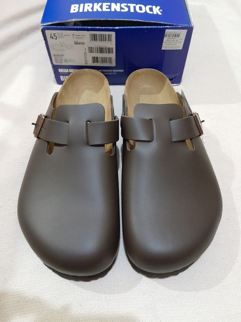 Birkenstock Boston BS (Category: Slippers & Slides) located in Manila. Submitted by spicykick (Listing ID 1468551760, Image 1). Description: - Brand: Birkenstock Boston BS Clogs - Color: Dark Brown - Size: 45 Regular Fit (290 mm) - Condition: Brand new with original blue box and hang tag - Features: Classic slip-on design, adjustable strap with metal buckle, signature cork footbed, and comfortable suede-lined insole.