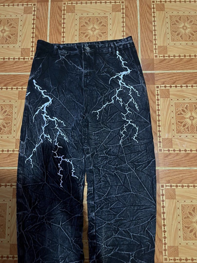 Black Acid Wash Jeans With Lightning Print (Category: Jeans) located in Kidapawan. Submitted by azythrift (Listing ID 1468695903, Image 2). Description: - Black acid wash denim jeans - Unique white lightning bolt print running down the front and back right leg - Relaxed fit with belt loops and button closure - Functional back pockets included - Condition: Wore a couple of times, denim is still in really solid shape.