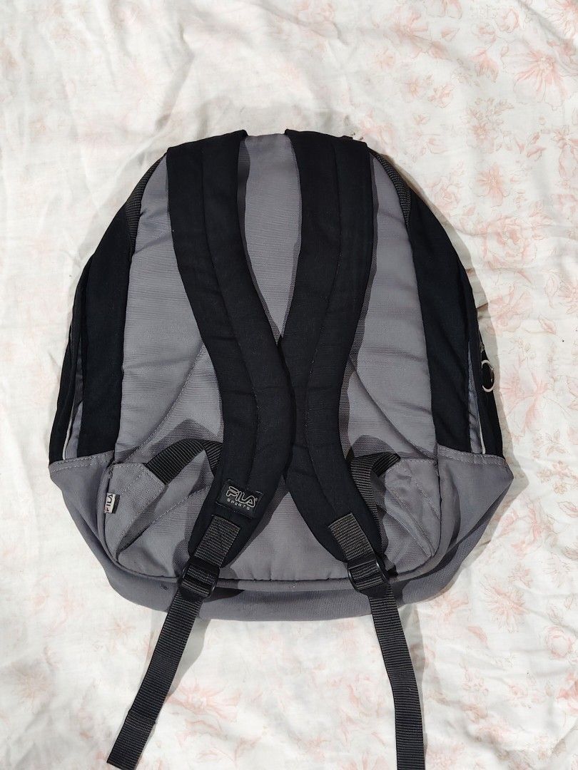 FILA black and gray casual backpack (Category: Backpacks) located in Bulacan. Submitted by angel.decluttersx (Listing ID 1468665047, Image 2). Description: L 17" W 16" all zippers are working no issue please buy at your own risk and manage your expectations.