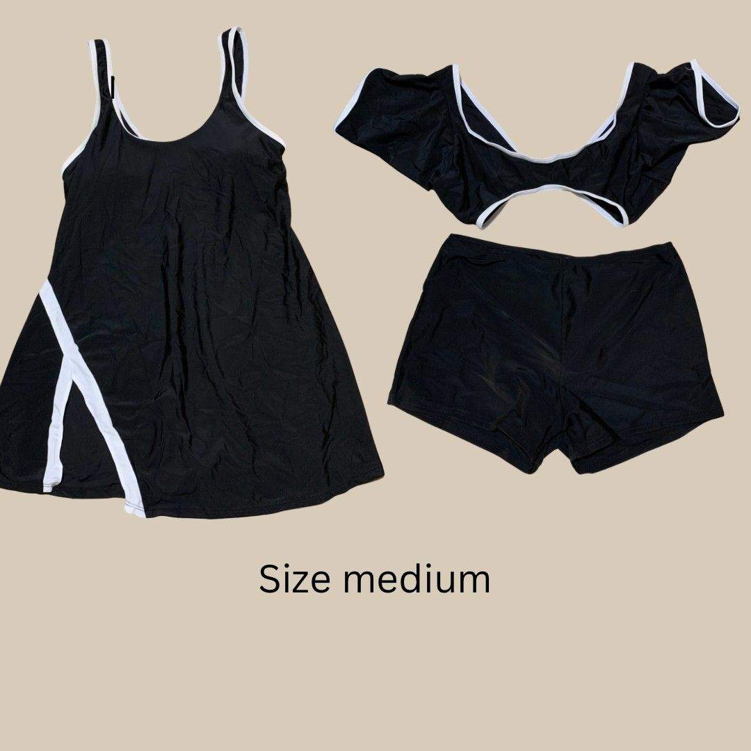 Black and White 3-Piece Swimsuit Set Medium (Category: Bikinis & Swimsuits) located in Pasay City. Submitted by zaceeee (Listing ID 1468711952, Image 1). Description: - Size: Medium - Set includes: Dress-style swimsuit, off-shoulder crop top, and matching swim shorts - Color: Classic black with white trim details and side split - Versatile 3-piece set, great for mixing and matching different beach looks - Mode of Payment: GCash - Shipping via J&T