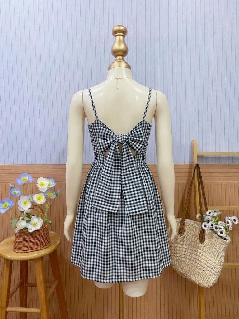 Black and White Gingham Mini Dress (Category: Dresses) located in Roxas City. Submitted by blairnstyle (Listing ID 1468623895, Image 2). Description: Color & Pattern: Classic black and white gingham check pattern. ​Neckline & Straps: Sweetheart neckline featuring wide shoulder straps. ​Back Detail: Can tie-back bow or just tie on the back. ​Silhouette & Length: Fitted bodice with a defined waist and a playful, flared mini-length skirt. ​Style: Cu
