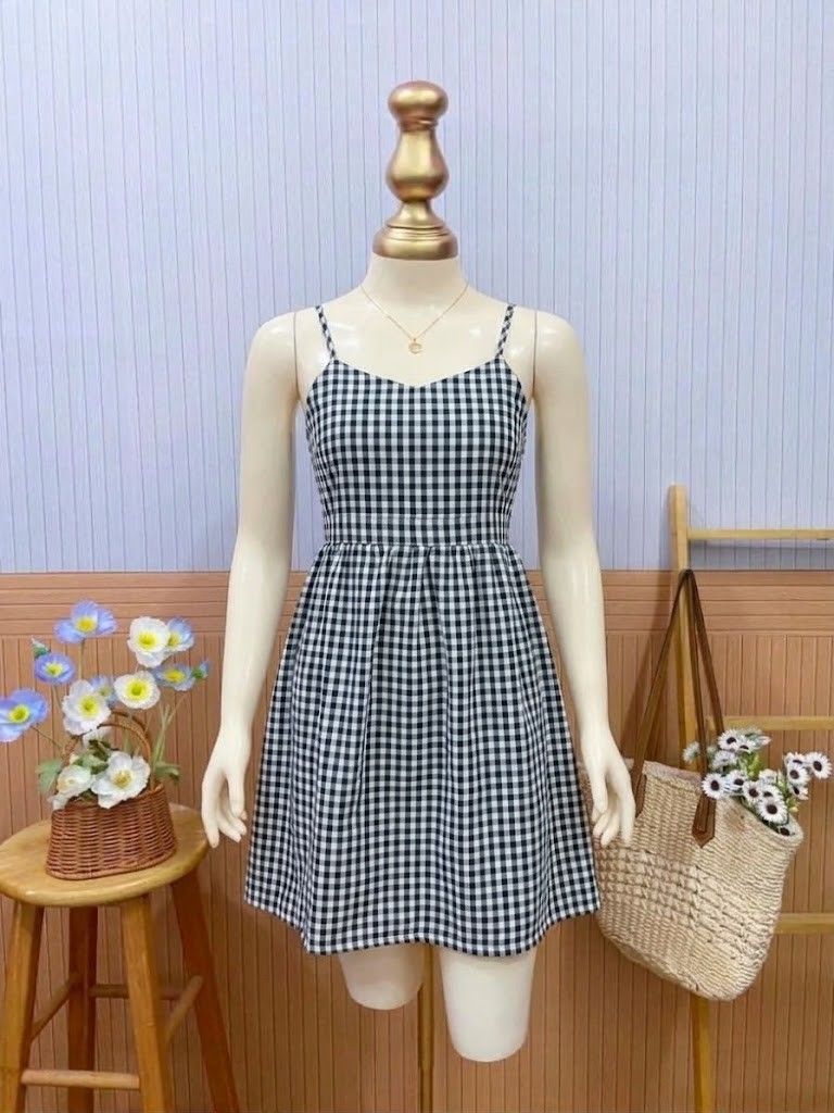 Black and White Gingham Mini Dress (Category: Dresses) located in Roxas City. Submitted by blairnstyle (Listing ID 1468623895, Image 1). Description: Color & Pattern: Classic black and white gingham check pattern. ​Neckline & Straps: Sweetheart neckline featuring wide shoulder straps. ​Back Detail: Can tie-back bow or just tie on the back. ​Silhouette & Length: Fitted bodice with a defined waist and a playful, flared mini-length skirt. ​Style: Cu