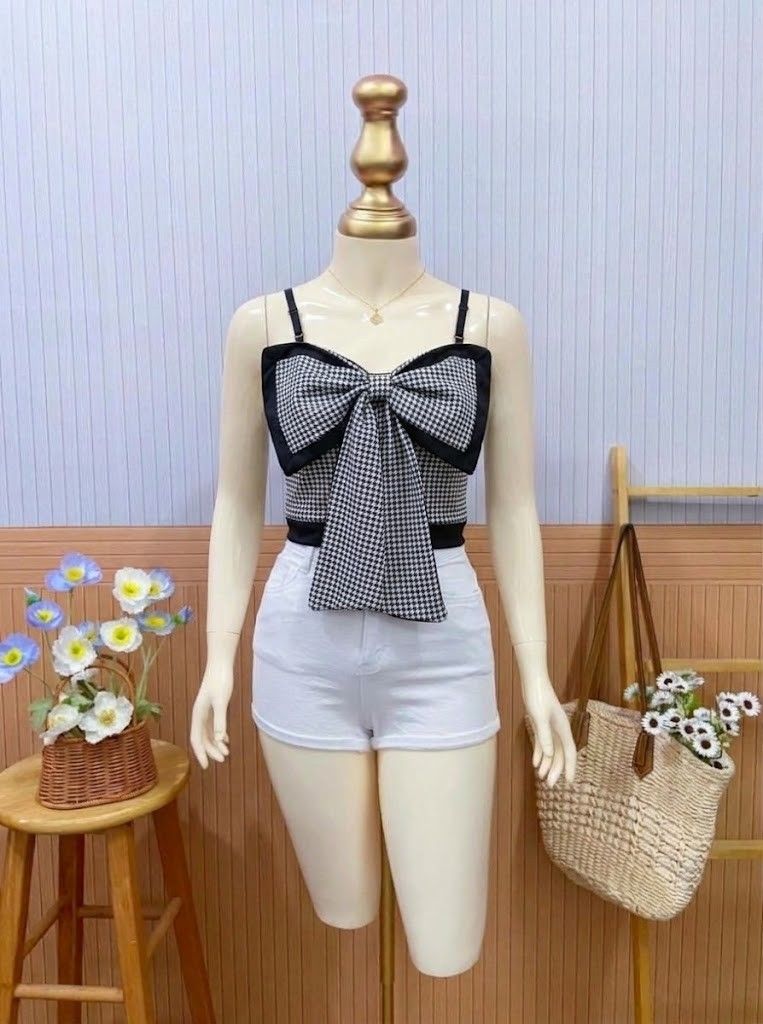 Black and White Houndstooth Bow Camisole Crop Top (Category: Sleeveless) located in Roxas City. Submitted by blairnstyle (Listing ID 1468618243, Image 1). Description: ​Color & Pattern: Classic black and white houndstooth pattern with black trim. ​Design Feature: Large statement bow accent centered on the front with long draping ends. ​Straps: Adjustable thin spaghetti straps. ​Silhouette: Fitted cropped style. ​Style: Chic, playful, and stylish—