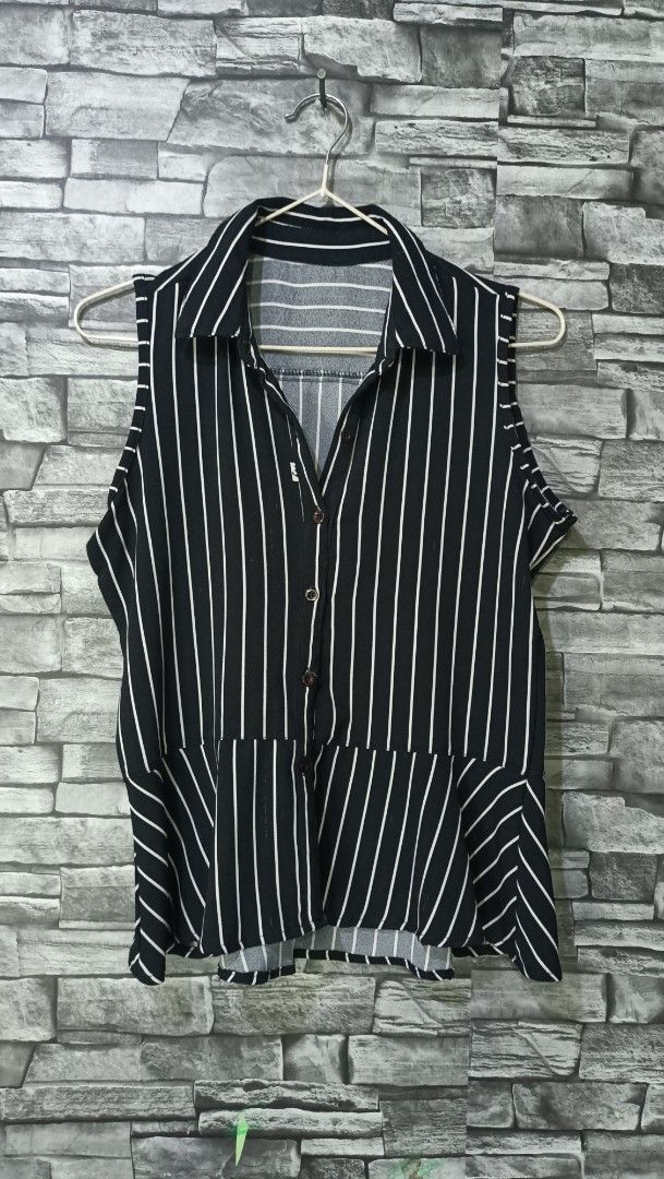 Black and White Striped Sleeveless Button-Up Blouse (Category: Blouses) located in Antipolo. Submitted by reahespiritu (Listing ID 1468647836, Image 1). Description: - Style: Black and white vertical striped sleeveless blouse - Details: Classic collar, front button closure with brown buttons, and a stylish diagonal-stripe peplum hem - Fabric: Lightweight and breathable, ideal for Philippine weather - Versatility: Easy to style with your favorite 