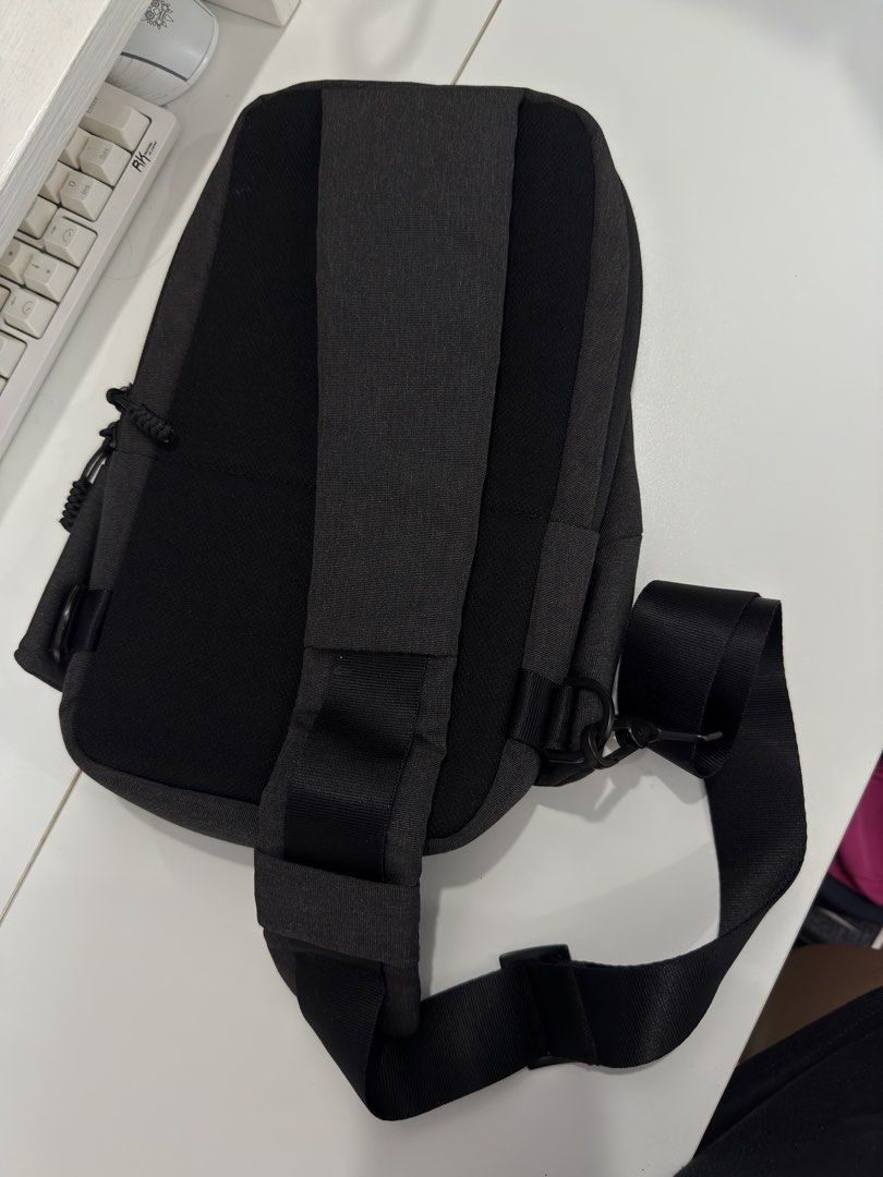 Black Crossbody Sling Bag Chest Pack (Category: Sling Bags) located in Manila. Submitted by chi.declutter (Listing ID 1468522978, Image 2). Description: - Color: Black with dark grey panels - Material: Clean canvas with minimal wear - Comfort: Adjustable strap and padded back - Storage: Zippered compartments and handy side loops - Ideal for: Daily commutes, school, or travel Free delivery for those who will avail 5 items and above..