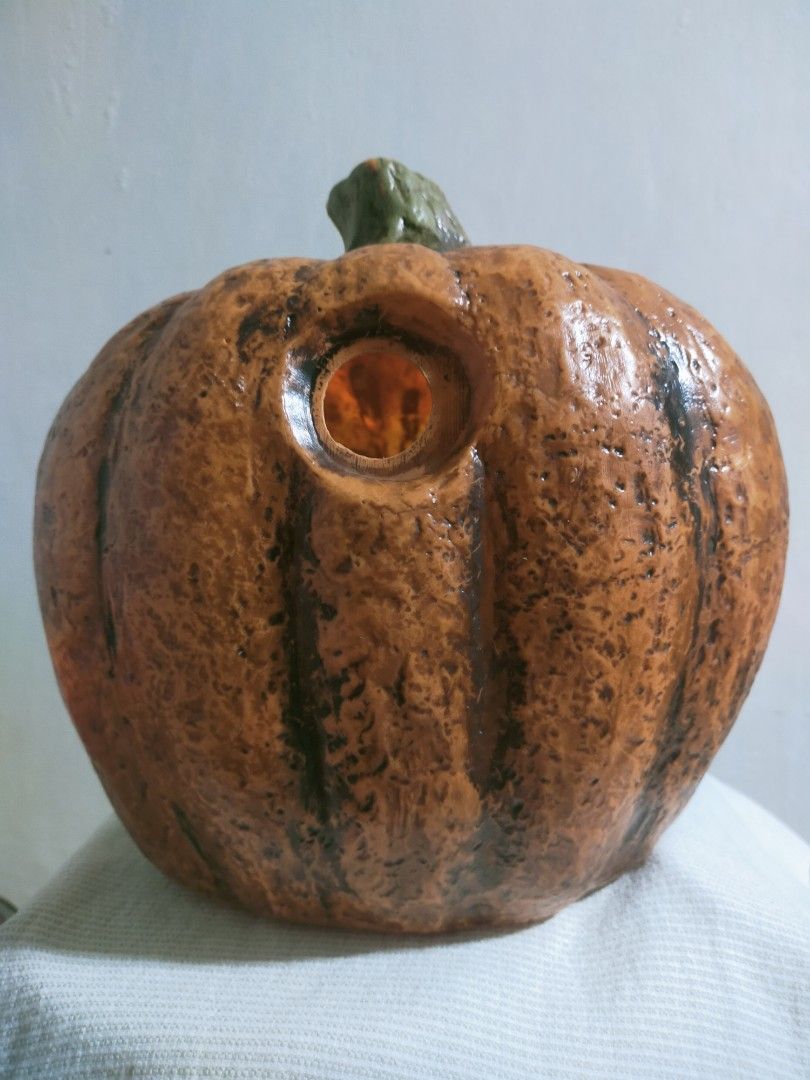 Black Jack-o'-Lantern Halloween Decoration (Category: Figurines & Statues) located in Quezon City. Submitted by mcmp1216 (Listing ID 1468628651, Image 3). Description: Halloween party decoration Orange body with dark weathered paint, a green-tinted stem, and aggressive facial features. Use: Suitable for tabletop or indoor/outdoor Halloween decoration. Material: Typically made from molded resin, plastic, or foam-like seasonal decor materials. You 