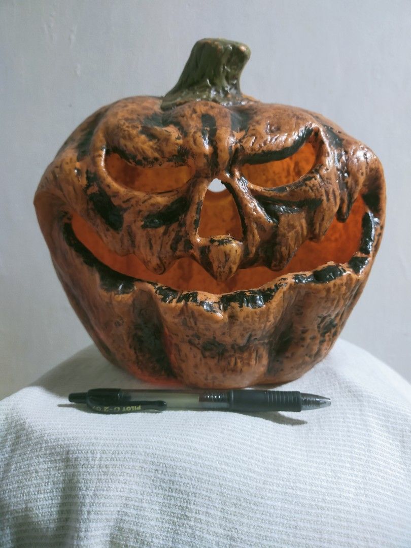 Black Jack-o'-Lantern Halloween Decoration (Category: Figurines & Statues) located in Quezon City. Submitted by mcmp1216 (Listing ID 1468628651, Image 2). Description: Halloween party decoration Orange body with dark weathered paint, a green-tinted stem, and aggressive facial features. Use: Suitable for tabletop or indoor/outdoor Halloween decoration. Material: Typically made from molded resin, plastic, or foam-like seasonal decor materials. You 