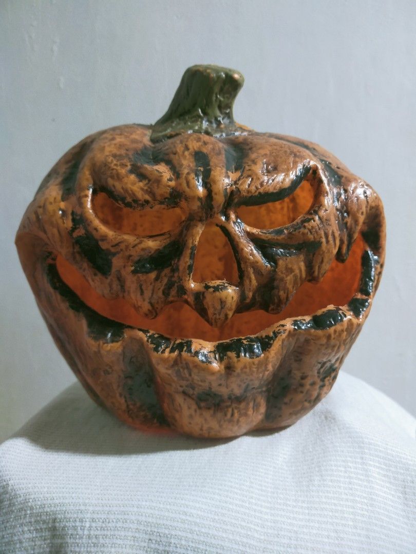 Black Jack-o'-Lantern Halloween Decoration (Category: Figurines & Statues) located in Quezon City. Submitted by mcmp1216 (Listing ID 1468628651, Image 1). Description: Halloween party decoration Orange body with dark weathered paint, a green-tinted stem, and aggressive facial features. Use: Suitable for tabletop or indoor/outdoor Halloween decoration. Material: Typically made from molded resin, plastic, or foam-like seasonal decor materials. You 