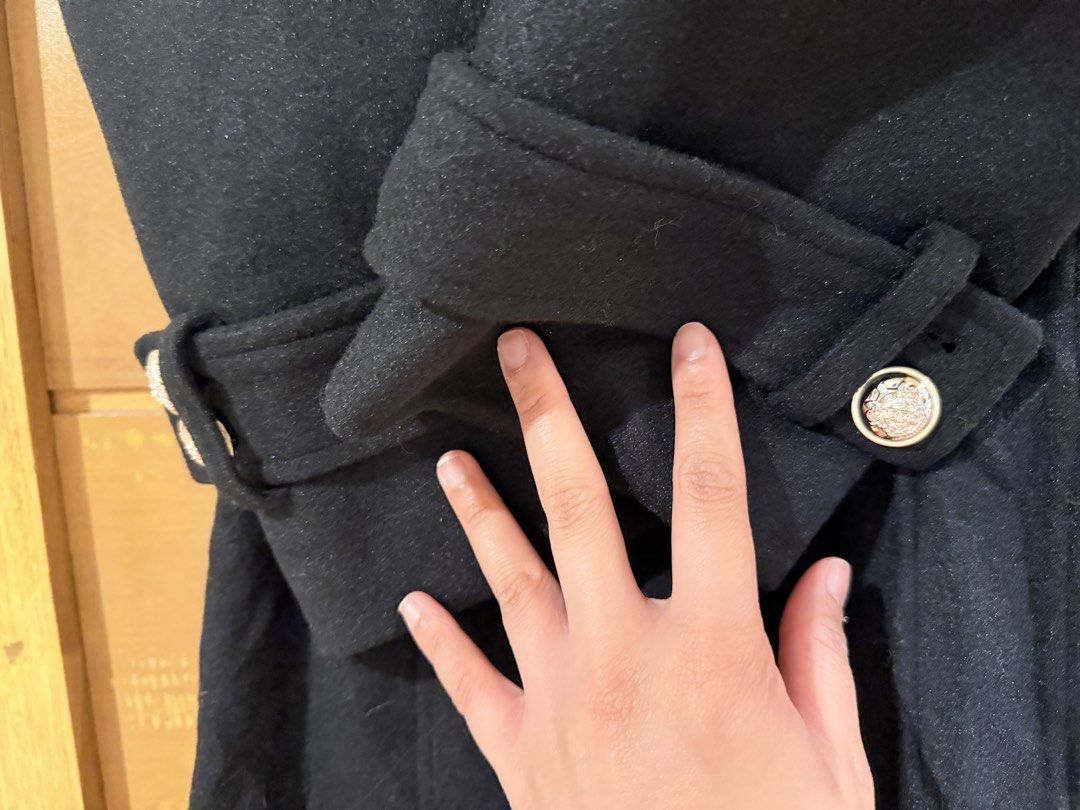 Black Long Wool Coat Double Breasted Trench With Belt (Category: Coats, Jackets and Outerwear) located in Bacoor. Submitted by caramelcart (Listing ID 1468635128, Image 3). Description: - Color: Black - Material: Heavy winter wool - Style: Double-breasted long trench coat with ornate silver-toned buttons - Fit & Details: Includes matching waist belt and sleeve strap details - Shoulders: Structured with trendy pleated puff sleeve caps - Measuremen