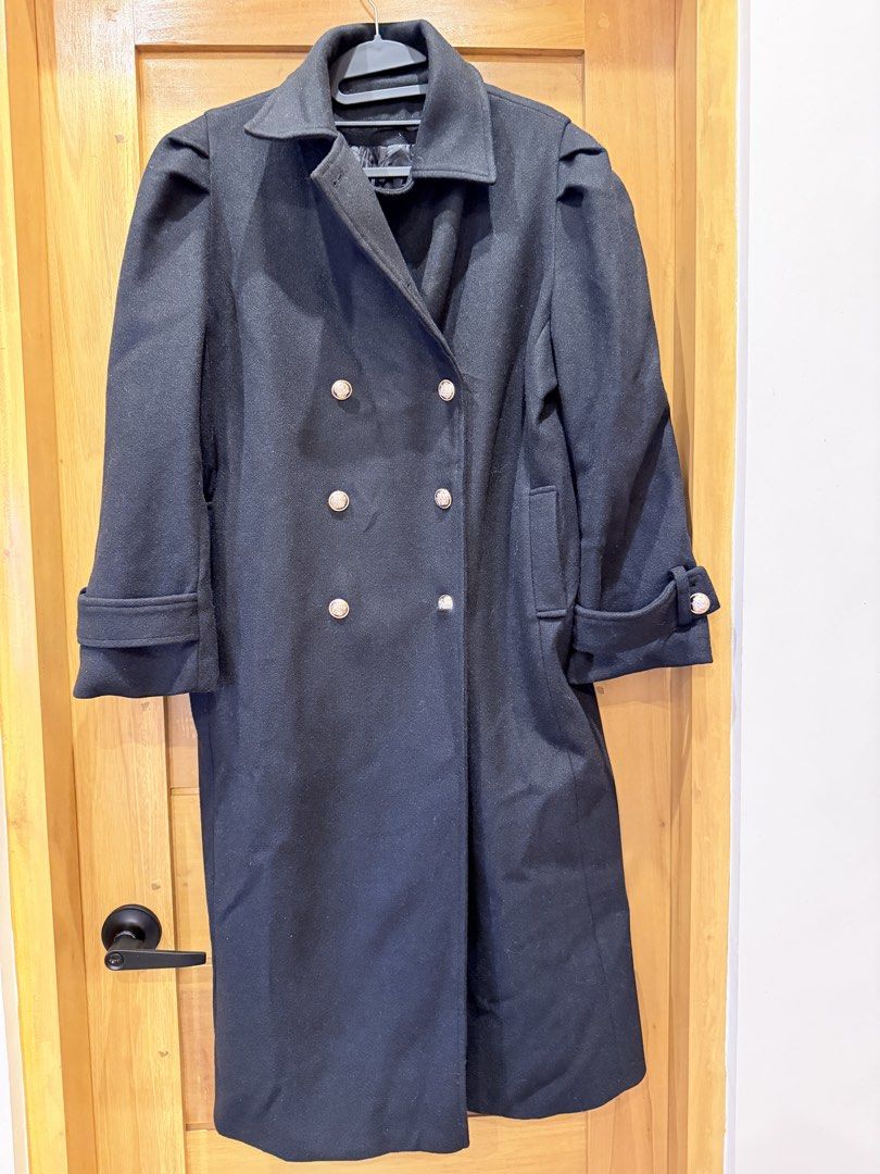 Black Long Wool Coat Double Breasted Trench With Belt (Category: Coats, Jackets and Outerwear) located in Bacoor. Submitted by caramelcart (Listing ID 1468635128, Image 1). Description: - Color: Black - Material: Heavy winter wool - Style: Double-breasted long trench coat with ornate silver-toned buttons - Fit & Details: Includes matching waist belt and sleeve strap details - Shoulders: Structured with trendy pleated puff sleeve caps - Measuremen