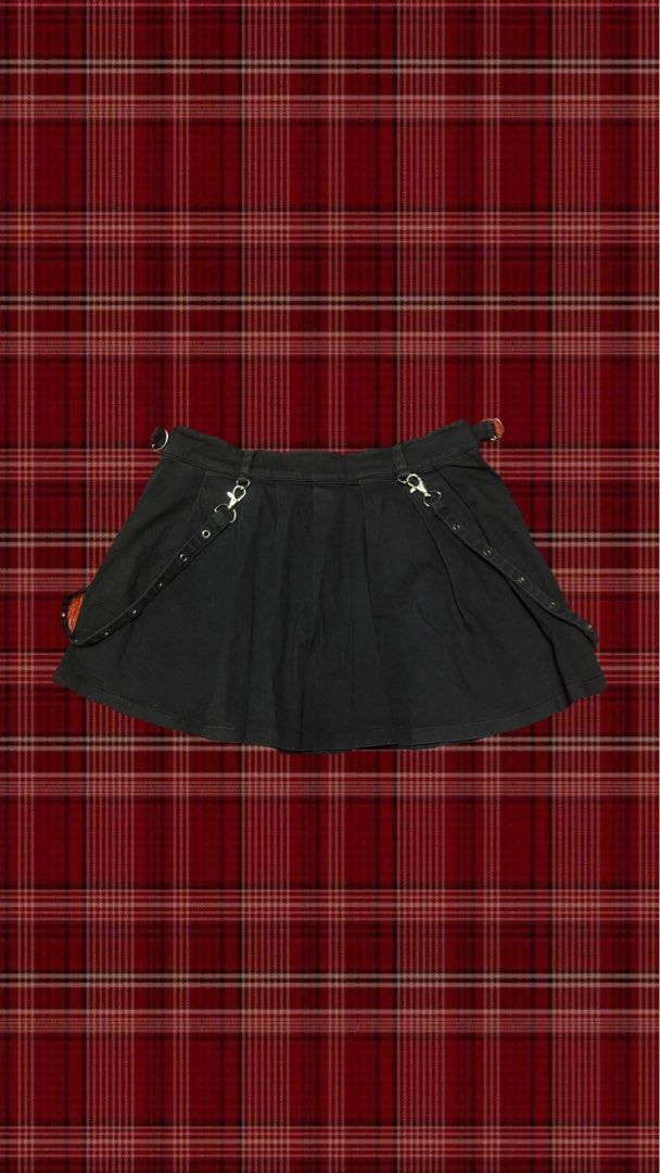 Black Punk Pleated Mini Skirt with Cargo Pockets (Category: Skirts) located in Quezon City. Submitted by gloriouslilith (Listing ID 1468605820, Image 2). Description: - Material: Black cotton denim - Style: Pleated mini skirt with heavy alt-rock and Y2K streetwear vibe - Hardware: Silver grommets, metal D-rings, and button-front closure - Pockets: Two front cargo pockets lined with small metal studs - Extras: Detachable strap accents on both side