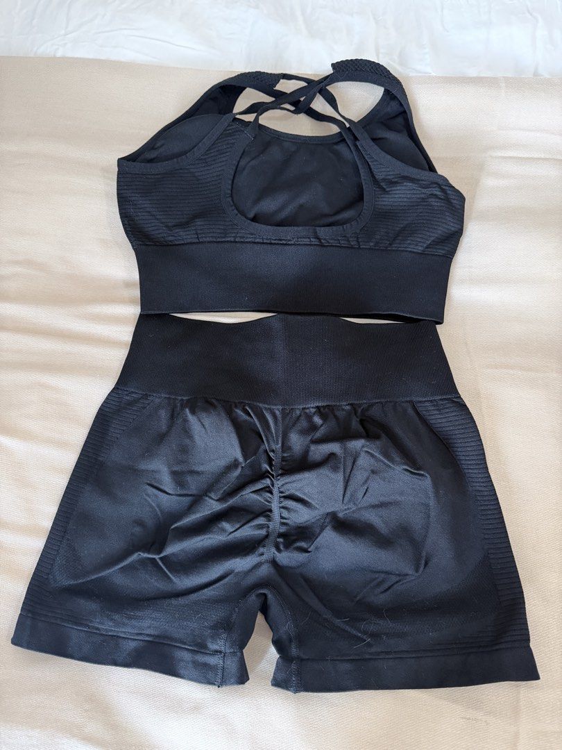 Black Seamless Workout Set Crop Top and Shorts (Category: Activewear) located in Taguig. Submitted by mengxir20193848 (Listing ID 1468543785, Image 3). Description: - Color: Black - Set includes: Supportive sports bra with criss-cross back and high-waisted scrunch butt biker shorts - Material/Design: Ribbed underband and side panels for maximum stretch and comfort - Fit: Super flattering, great for gym workouts and active lifestyles - Condition: 