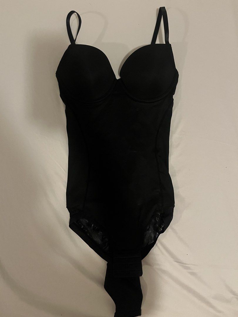 Black shapewear bodysuit with underwire cups size S (Category: Undergarments & Loungewear) located in Manila. Submitted by vees.shop (Listing ID 1468684738, Image 1). Description: - Color: Black - Size: Small (EUR 32/70, USA S, IT 2, AU 10, FR 85) - Built-in underwire cups for support - Adjustable straps for a custom fit - Mesh lace detailing at leg openings - Ruched back design for added shape - Great smoothing piece for fitted outfits - Mode of