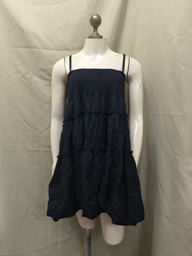 Black tiered spaghetti strap mini dress (Category: Dresses) located in Marikina City. Submitted by mrlfashion23 (Listing ID 1468588837, Image 1). Description: - Style: Black spaghetti strap mini dress with a trendy bubble hem - Design: Fitted bodice, square neckline, and cute tiered ruffles - Comfort: Made from lightweight fabric, perfect for sunny weather - Fit: Easy slip-on style for quick and effortless dressing - Condition: Brand new / Excell