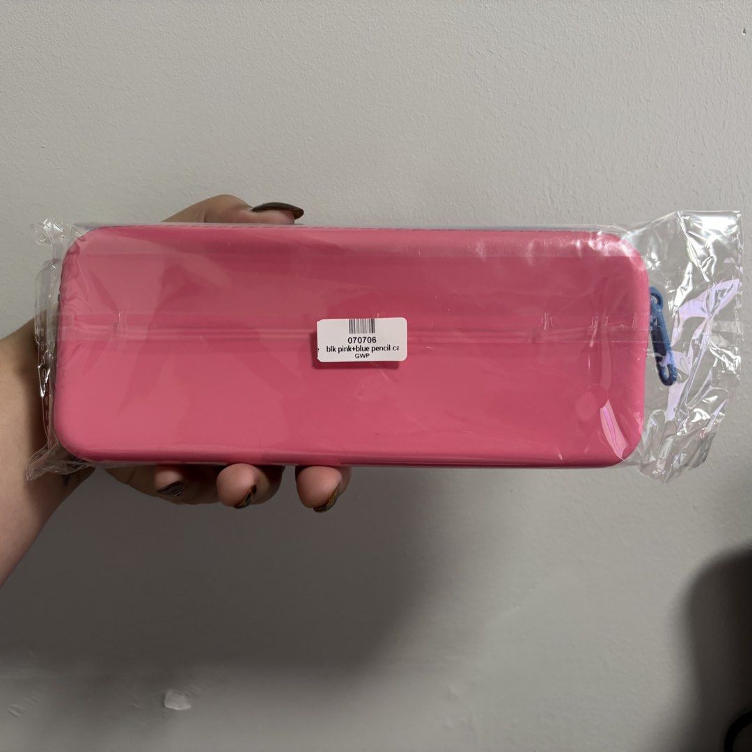 blk cosmetics Pink and Blue Jelly Case (Category: Purses & Pouches) located in Tanza. Submitted by iamdhana (Listing ID 1468711440, Image 2). Description: A freebie I got at blk :) - Color: Pink with black embossed branding - Closure: Blue top zipper - Condition: Brand new, unused, and still sealed in original plastic packaging - Authenticity/Details: Includes original barcode sticker on the back - Perfect for organizing your pens, pencils, and e