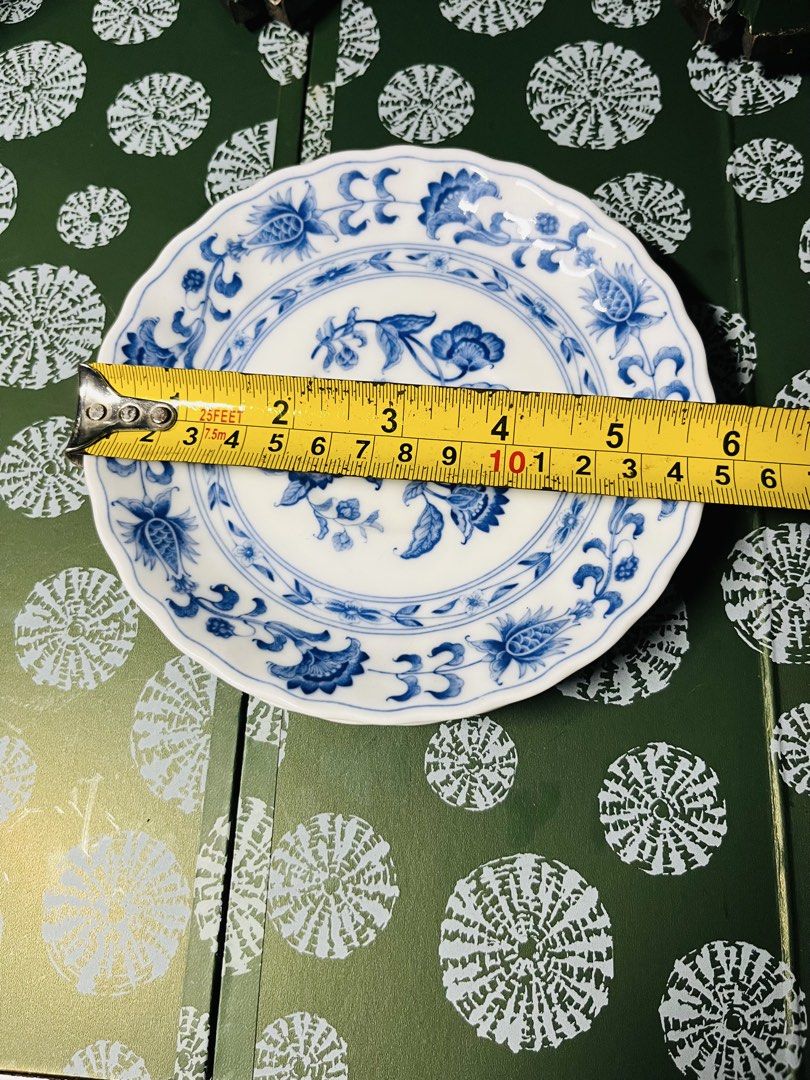 Blue and white ceramic small plates set (Category: Dinnerware & Cutlery) located in Malabon City. Submitted by mgsurplus (Listing ID 1468653718, Image 2). Description: - Set of 2 small ceramic plates - Measures approximately 6 inches across - Traditional blue and white porcelain design with intricate floral patterns - Elegant scalloped rims - Ideal for serving small snacks, appetizers, or home display.