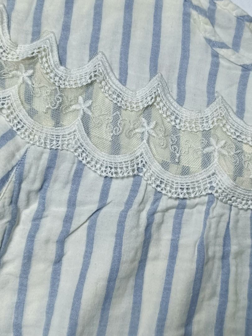 Blue and White Striped Lace Blouse (Category: Blouses) located in Cavite. Submitted by topcheers (Listing ID 1468636941, Image 2). Description: 💙 Blue & White Striped Lace Blouse 📏 Size: L (Bust: 42” | Armhole: 10” | Cuffs: 14”) ✨ Condition: 9/10 – Excellent, gently used 💸 Price: ₱30 Description: A charming and feminine blouse featuring blue and white vertical stripes with delicate lace detailing across the chest. Designed with flutter sleeves