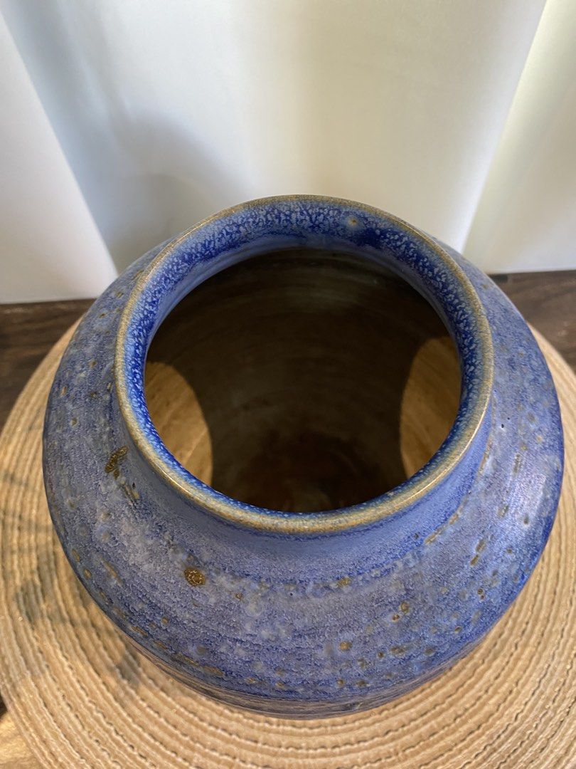 Blue Ceramic Vase Studio Pottery Textured Glaze (Category: Vases & Decorative Bowls) located in San Pedro. Submitted by jingay81 (Listing ID 1468708770, Image 3). Description: - Material: Heavy pottery ceramic construction - Color: Blue with earthy brown undertones - Design: Textured speckled glaze and horizontal grooves with an open mouth - Shape: Rounded body - Height: Approximately 8 inches - Condition: Brand new / Excellent.