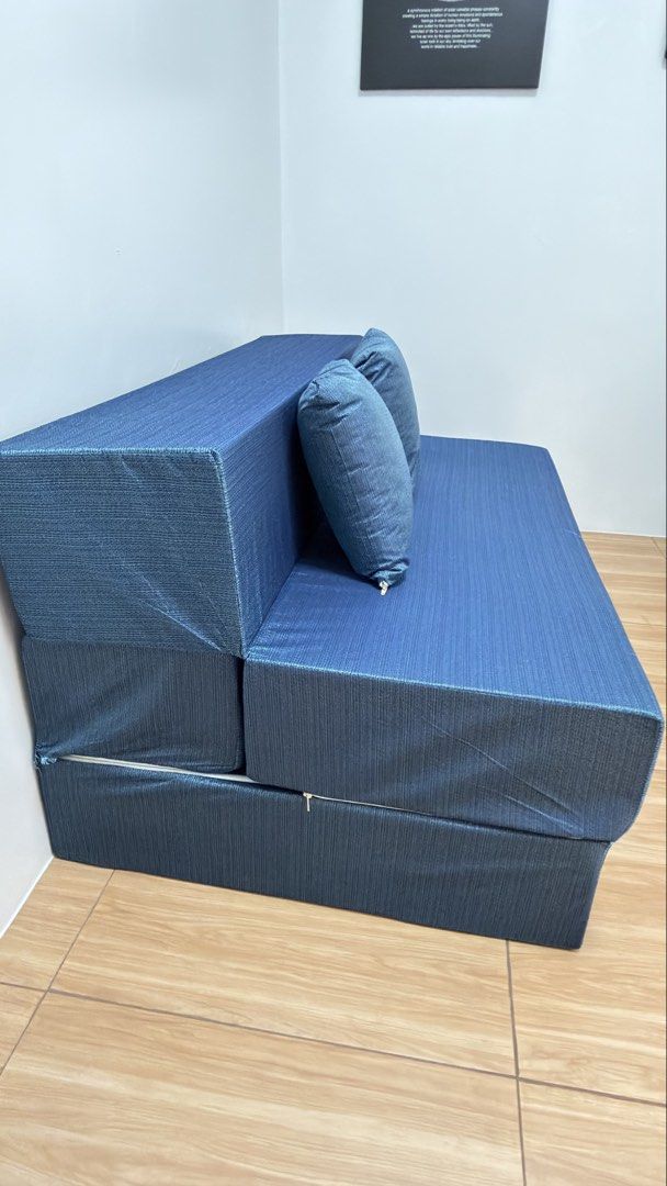 Blue Convertible Sofa Bed with Pillows (Category: Sofas) located in Las Pinas. Submitted by ann_1239 (Listing ID 1468554174, Image 2). Description: Versatile blue fabric convertible sofa bed. Easily transforms from a compact couch to a flat mattress. Includes two matching toss pillows. Perfect space-saving furniture for apartments, living rooms, or guest rooms..