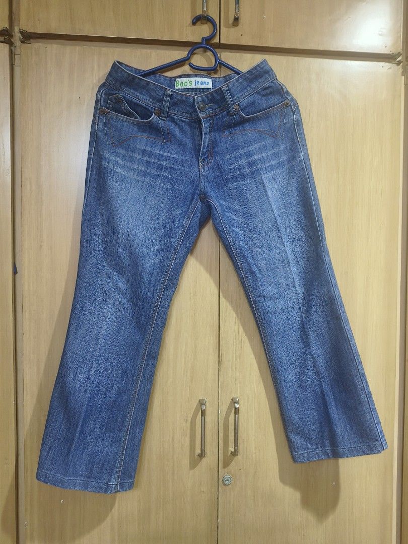 Blue Denim (Category: Jeans) located in Quezon City. Submitted by majasaw88 (Listing ID 1468569560, Image 1). Description: preloved - Brand: Boo's jeans - Size: Tagged 29 - Wash: Medium blue with slight fading for a worn-in look - Fit: Classic bootcut or straight leg style - Details: Contrast orange stitching, front scoop pockets, and back flap pockets with intricate yoke seaming - Material: Durable, high-quality denim.