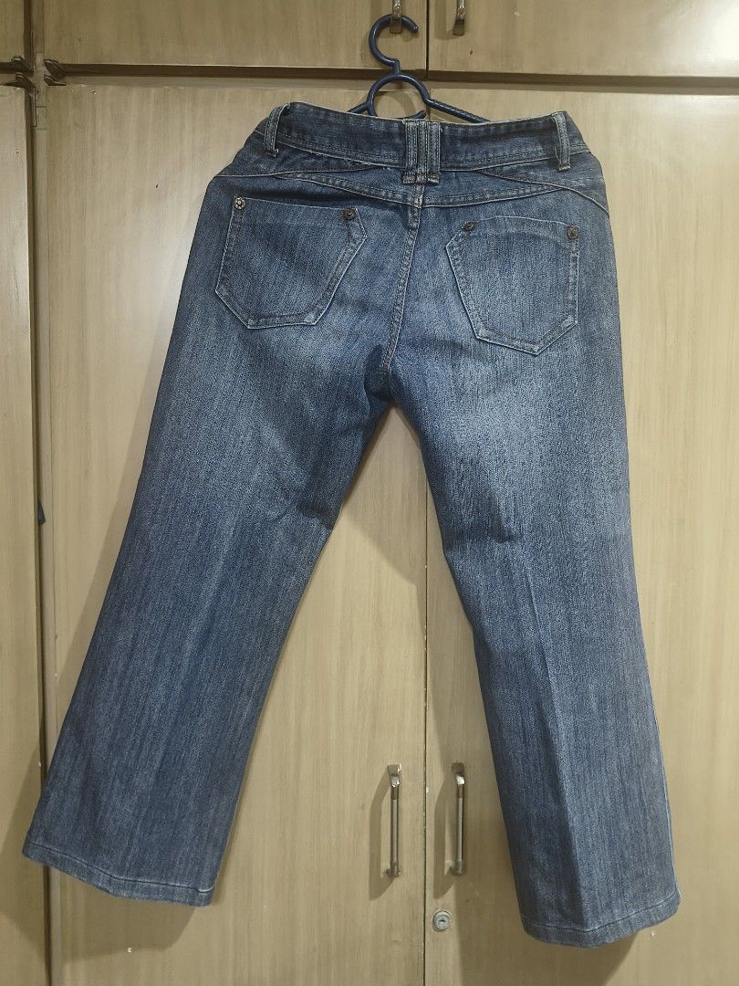 Blue Denim (Category: Jeans) located in Quezon City. Submitted by majasaw88 (Listing ID 1468569560, Image 3). Description: preloved - Brand: Boo's jeans - Size: Tagged 29 - Wash: Medium blue with slight fading for a worn-in look - Fit: Classic bootcut or straight leg style - Details: Contrast orange stitching, front scoop pockets, and back flap pockets with intricate yoke seaming - Material: Durable, high-quality denim.