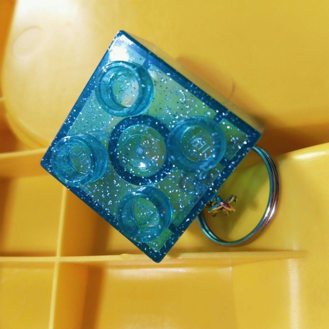 Modeled Original LEGO Duplo Markings Glittered Keychain (Category: Lego & Building Sets) located in Pasig City. Submitted by babylove2003 (Listing ID 1468641345, Image 3). Description: Modeled Original LEGO Duplo markings. Fun accessory for keys or bags..
