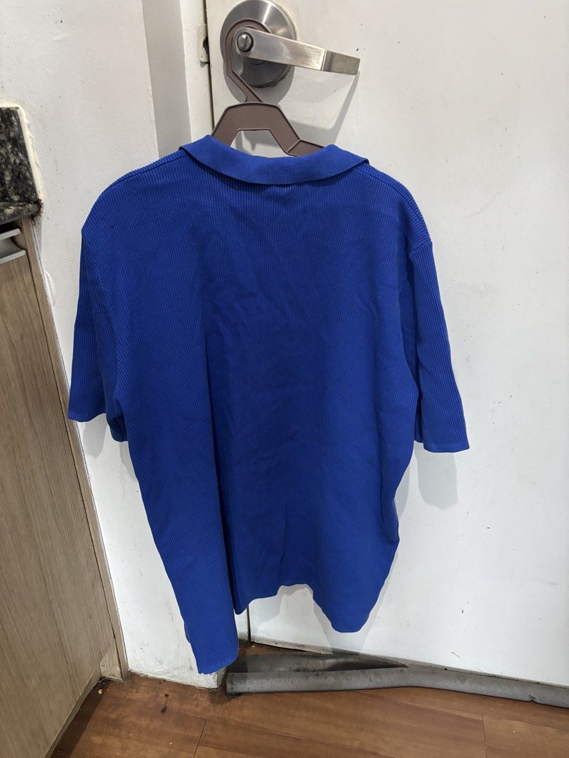 Blue Ribbed Knitted Button-Up Polo (Category: Longsleeves) located in Batangas. Submitted by preloved_by_rj (Listing ID 1468533849, Image 2). Description: - Brand: Smyth - Size: XL - Color: Bright royal blue - Style: Open front button-down with short sleeves and lapel collar - Details: Single left chest pocket and all-over ribbed knit texture - Condition: Clean and well-stored - Perfect for pairing with casual tees or tanks - used thrice only.