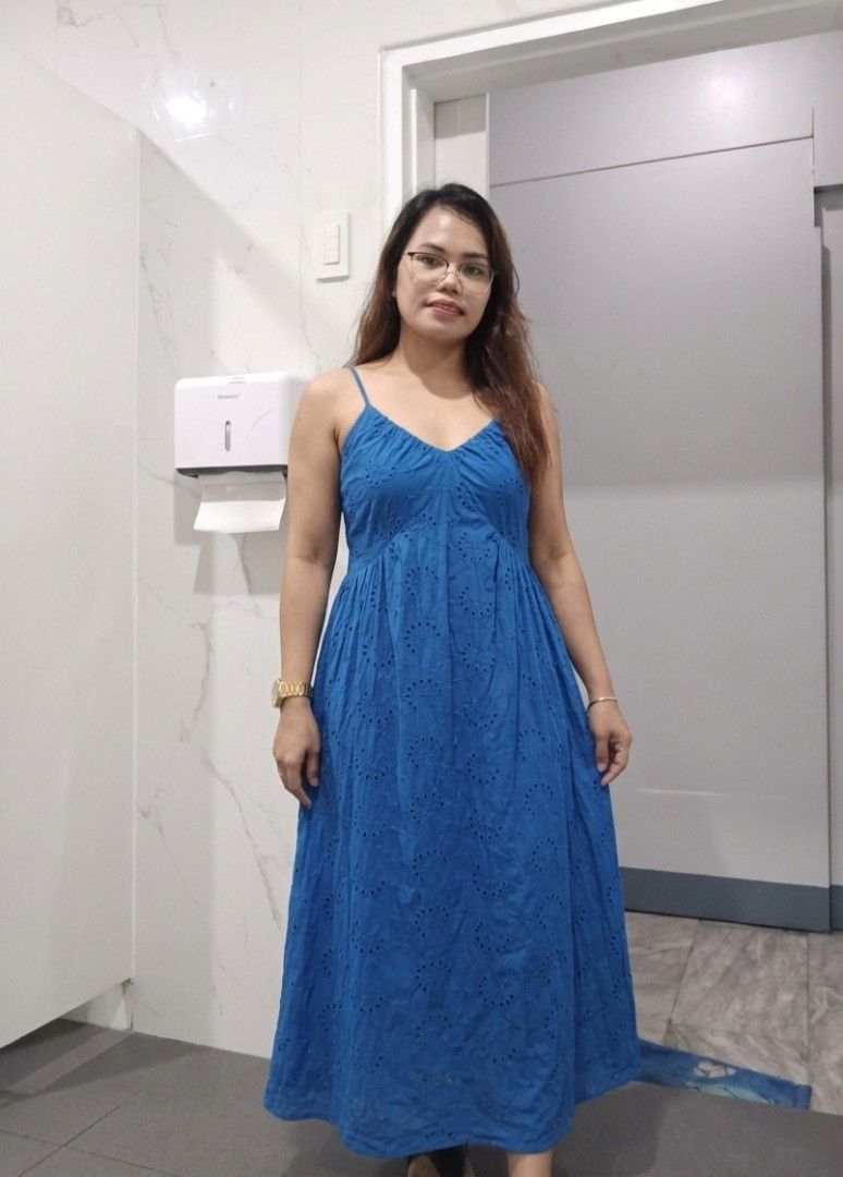 Blue Spaghetti Strap Eyelet Maxi Dress (Category: Dresses) located in Quezon City. Submitted by davidclothing (Listing ID 1468517178, Image 1). Description: - Color: Bright blue - Design: Eyelet cut-out pattern all over - Neckline & Bust: V-neck with a gathered bust and spaghetti straps - Fit: Comfortable smocked back panel - Style: Long, flowy maxi skirt - Occasion: Great for casual day outs or beach trips.