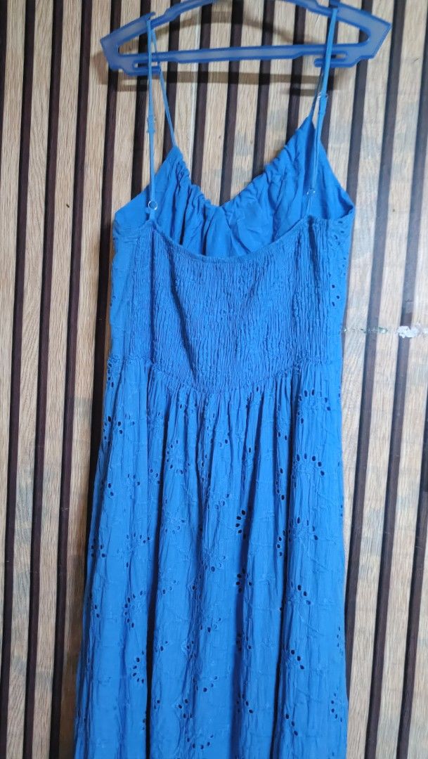 Blue Spaghetti Strap Eyelet Maxi Dress (Category: Dresses) located in Quezon City. Submitted by davidclothing (Listing ID 1468517178, Image 2). Description: - Color: Bright blue - Design: Eyelet cut-out pattern all over - Neckline & Bust: V-neck with a gathered bust and spaghetti straps - Fit: Comfortable smocked back panel - Style: Long, flowy maxi skirt - Occasion: Great for casual day outs or beach trips.