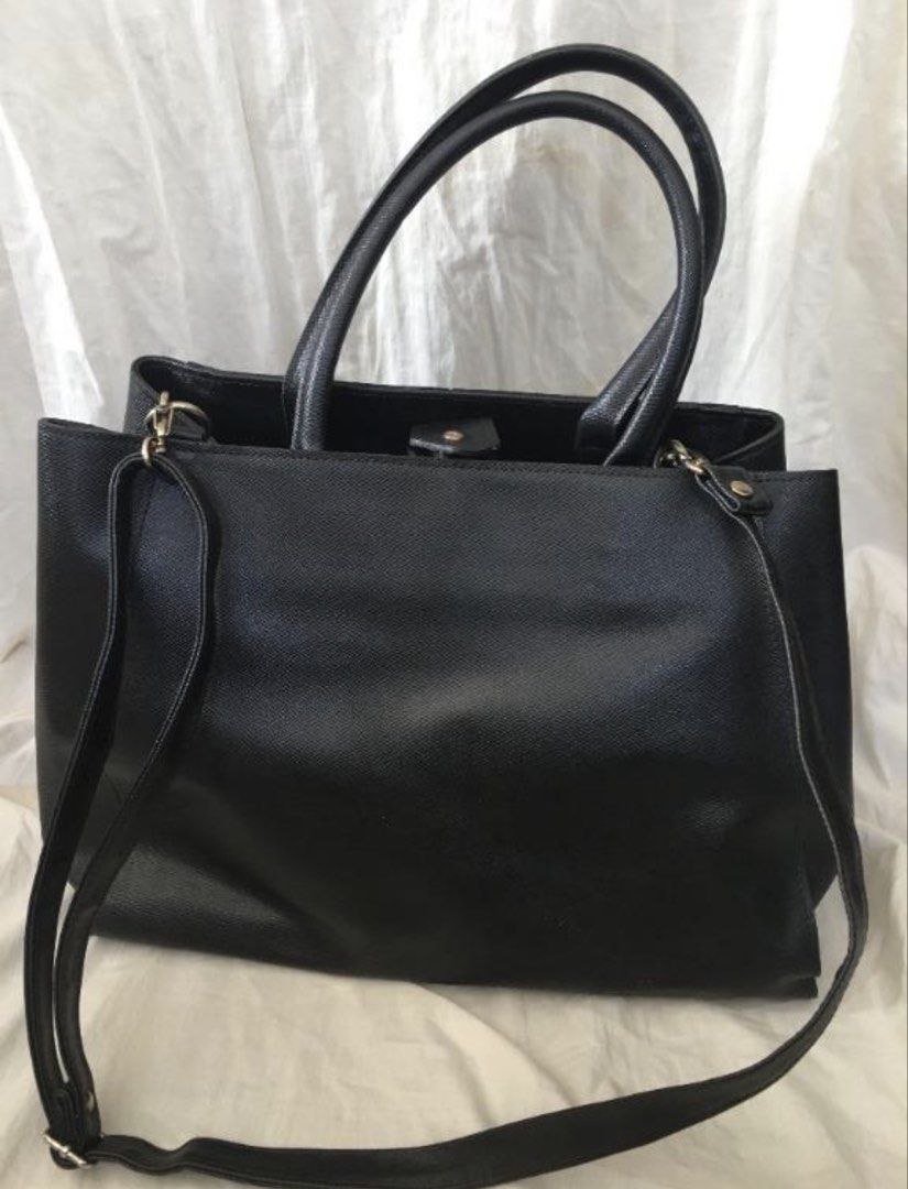 BONEBI Black PU Leather Tote Bag with Shoulder Strap (Category: Tote Bags) located in Paranaque City. Submitted by craftywoobieph (Listing ID 1468558908, Image 1). Description: - Brand/Origin: Bonebi, Made in Korea - Material: Premium black PU leather with brown fabric lining - Versatile Carry: Includes dual top handles and a detachable shoulder strap - Organization: Features a zipped middle divider compartment and extra interior pockets - Closur