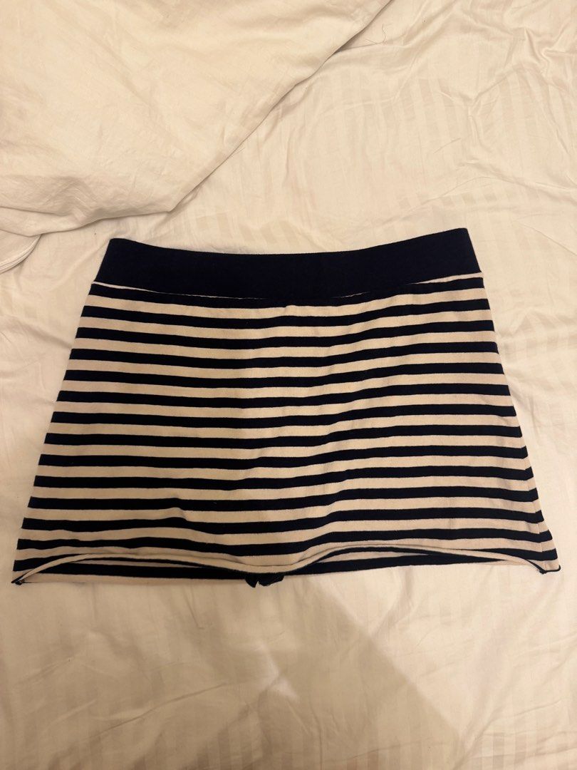 Brandy Melville Striped Skort (Category: Skirts) located in Mandaluyong City. Submitted by izabelly (Listing ID 1468656575, Image 1). Description: - Brand: Brandy Melville - Style: Navy blue and white striped skort with skater skirt overlay - Comfort: Built-in shorts underneath, super comfy cotton material - Condition: Brand new with original store tags attached - Size: One size fits most.