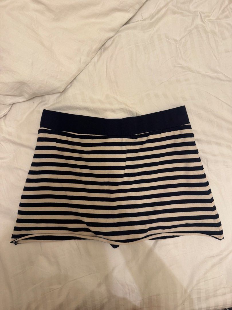 Brandy Melville Striped Skort (Category: Skirts) located in Mandaluyong City. Submitted by izabelly (Listing ID 1468656575, Image 3). Description: - Brand: Brandy Melville - Style: Navy blue and white striped skort with skater skirt overlay - Comfort: Built-in shorts underneath, super comfy cotton material - Condition: Brand new with original store tags attached - Size: One size fits most.