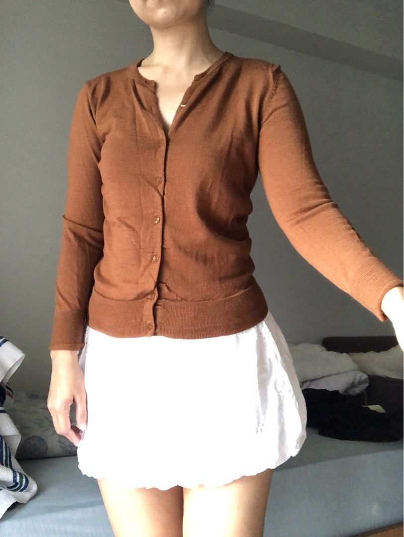 Brown button-up knit cardigan sweater (Category: Coats, Jackets and Outerwear) located in Makati City. Submitted by magwayr19 (Listing ID 1468510999, Image 2). Description: - Size: S - Color: Warm brown - Material: Knit - Design: Classic round neckline with small front buttons - No brand.