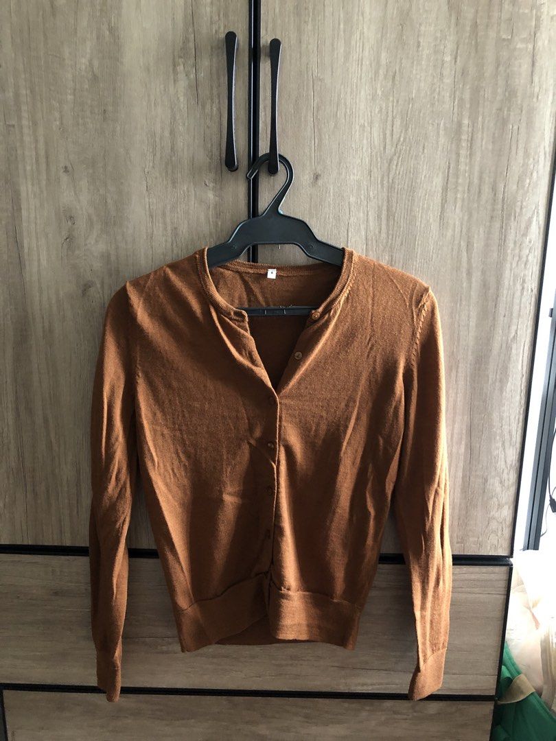 Brown button-up knit cardigan sweater (Category: Coats, Jackets and Outerwear) located in Makati City. Submitted by magwayr19 (Listing ID 1468510999, Image 1). Description: - Size: S - Color: Warm brown - Material: Knit - Design: Classic round neckline with small front buttons - No brand.