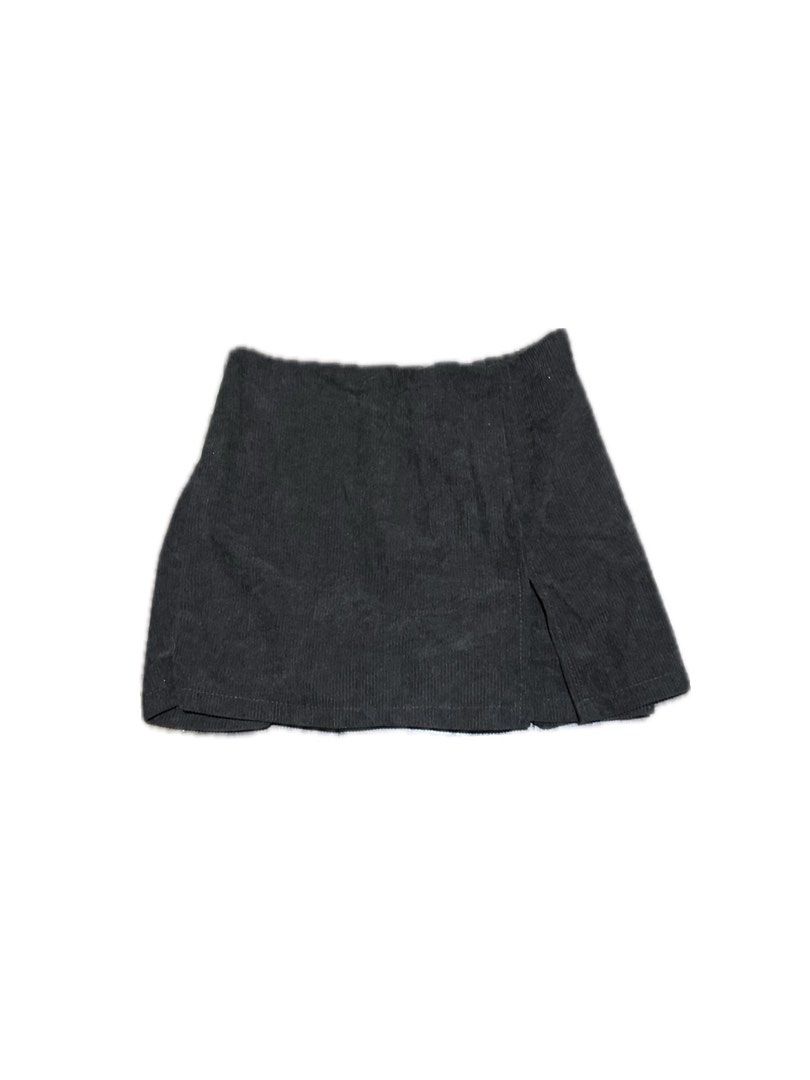 Brown Corduroy Mini Skirt with Front Slit (Category: Skirts) located in Manila. Submitted by yumidrobeee (Listing ID 1468544741, Image 1). Description: - Color: Black - Material: Textured corduroy with vertical ribs - Fit: Mini length with a chic front slit on the right side - Closure: Easy back zip - Styling: Pairs effortlessly with boots or sneakers.