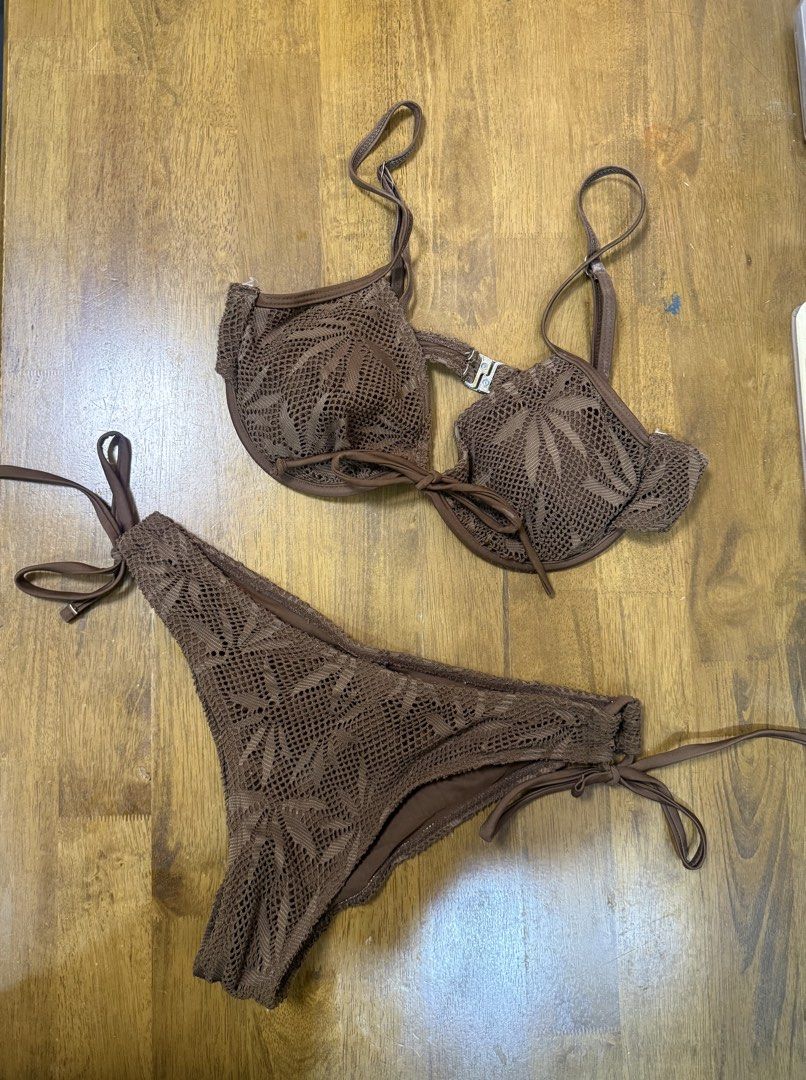 Brown crochet pattern bikini swimsuit set (Category: Bikinis & Swimsuits) located in Makati City. Submitted by shoprory (Listing ID 1468596657, Image 1). Description: - Style: Brown crochet two-piece swimsuit with an intricate leaf-like knit pattern - Top: Features underwire support, adjustable straps, and a cute front tie detail - Bottoms: Designed with adjustable side ties for a customizable, comfortable fit - Ideal For: Beach trips, resort get