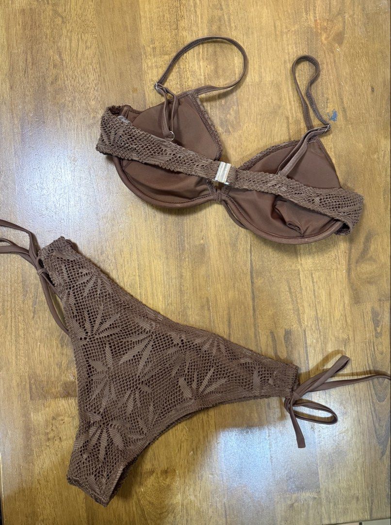 Brown crochet pattern bikini swimsuit set (Category: Bikinis & Swimsuits) located in Makati City. Submitted by shoprory (Listing ID 1468596657, Image 2). Description: - Style: Brown crochet two-piece swimsuit with an intricate leaf-like knit pattern - Top: Features underwire support, adjustable straps, and a cute front tie detail - Bottoms: Designed with adjustable side ties for a customizable, comfortable fit - Ideal For: Beach trips, resort get