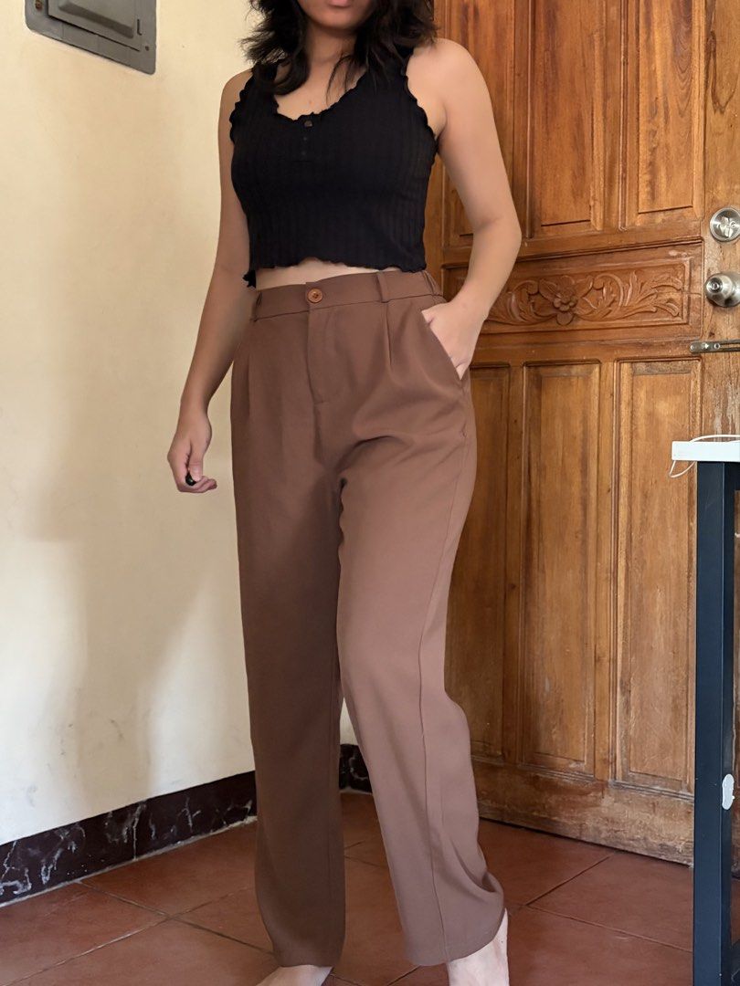 Brown high-waisted pleated trousers with button closure (Category: Trousers) located in Pasig City. Submitted by catherinea38704 (Listing ID 1468627202, Image 1). Description: - Style: High-waisted wide-leg trousers with front pleats - Color: Brown - Features: Functional side pockets and secure button closure - Condition: Worn a few times, excellent fabric quality - Status: Clean, washed, and ready to wear Waistline: 25-26 inches Location: Caniog